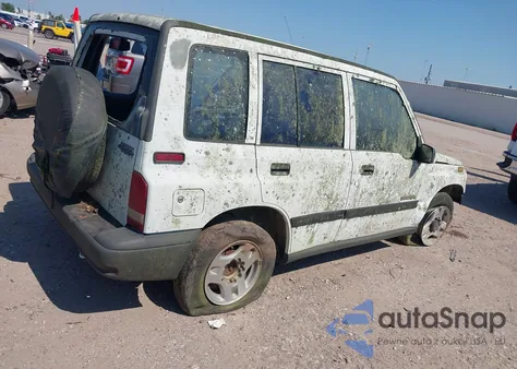 1996 Geo Tracker from USA, damaged, VIN 2CNBE1369T6943219